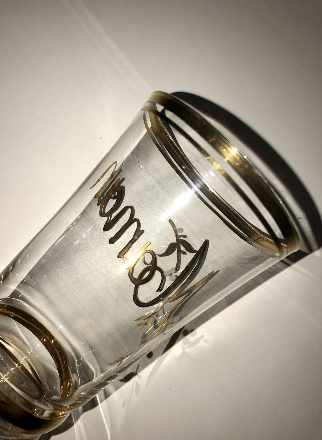 Antique gilded glass with the inscription Maman