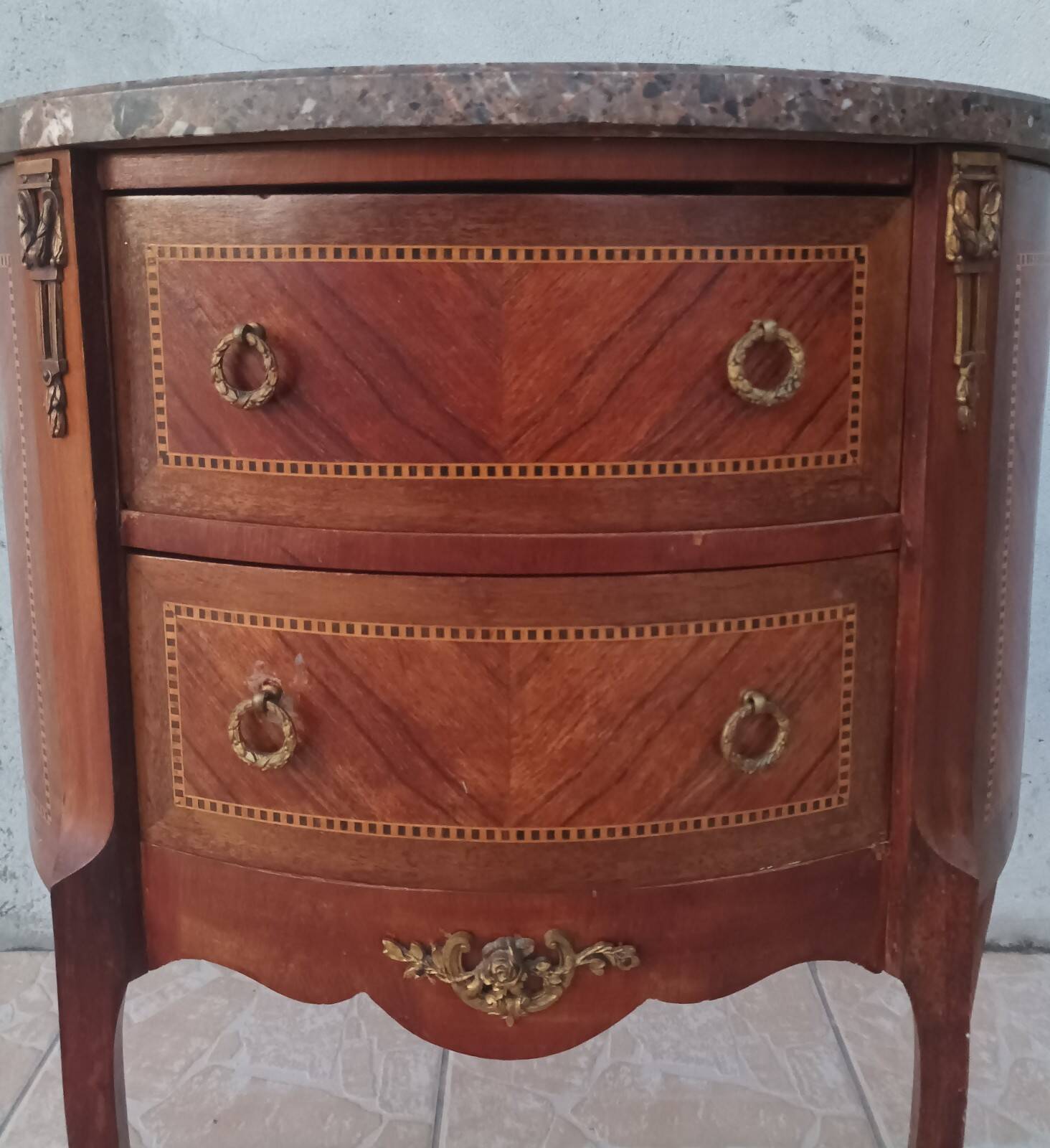 Half-moon commode in Louis XV style with walnut veneer.