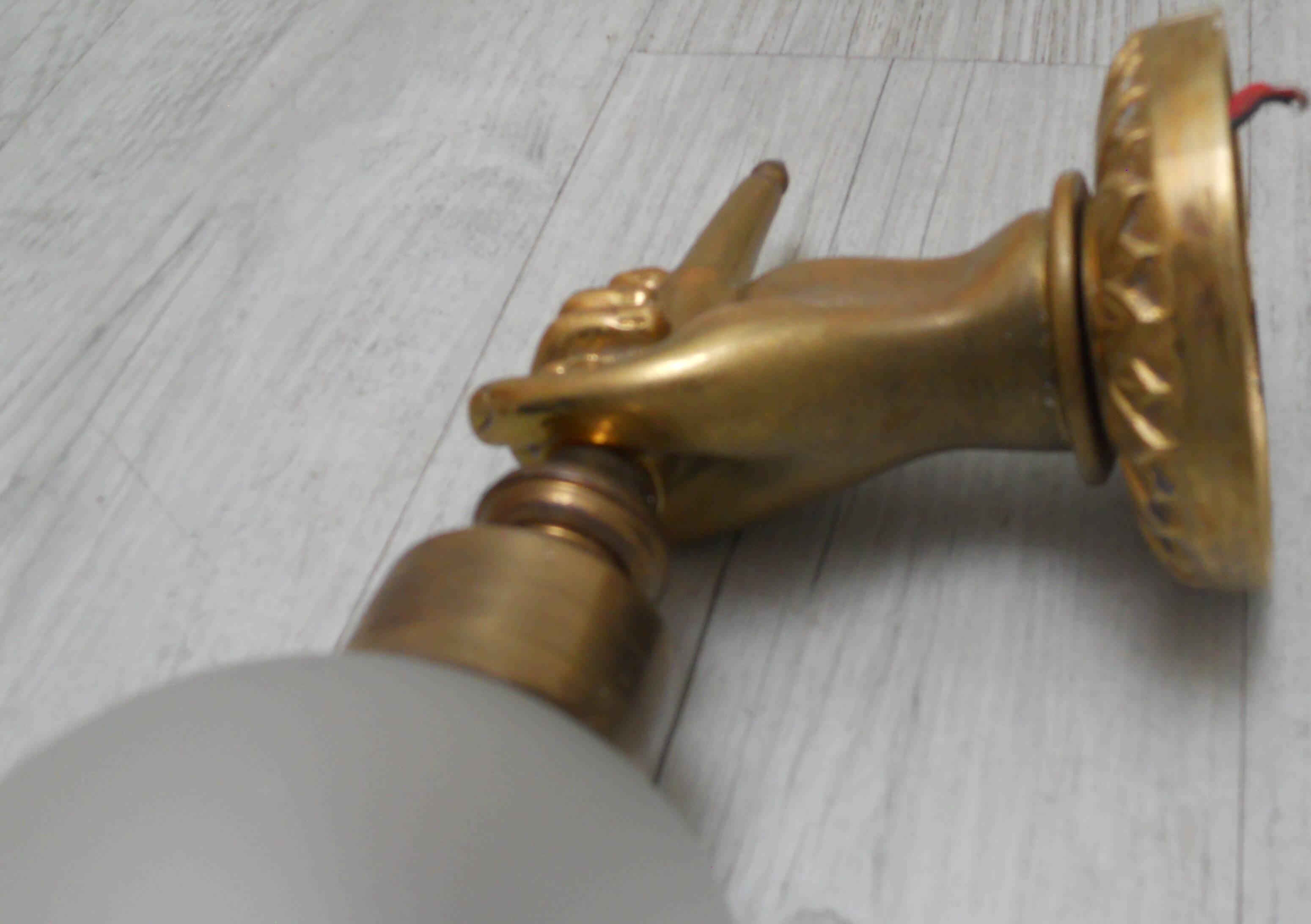 Pair of golden bronze flambeau sconces