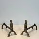 Pair of bronze andirons with seated shamans monogrammed Anton Prinner