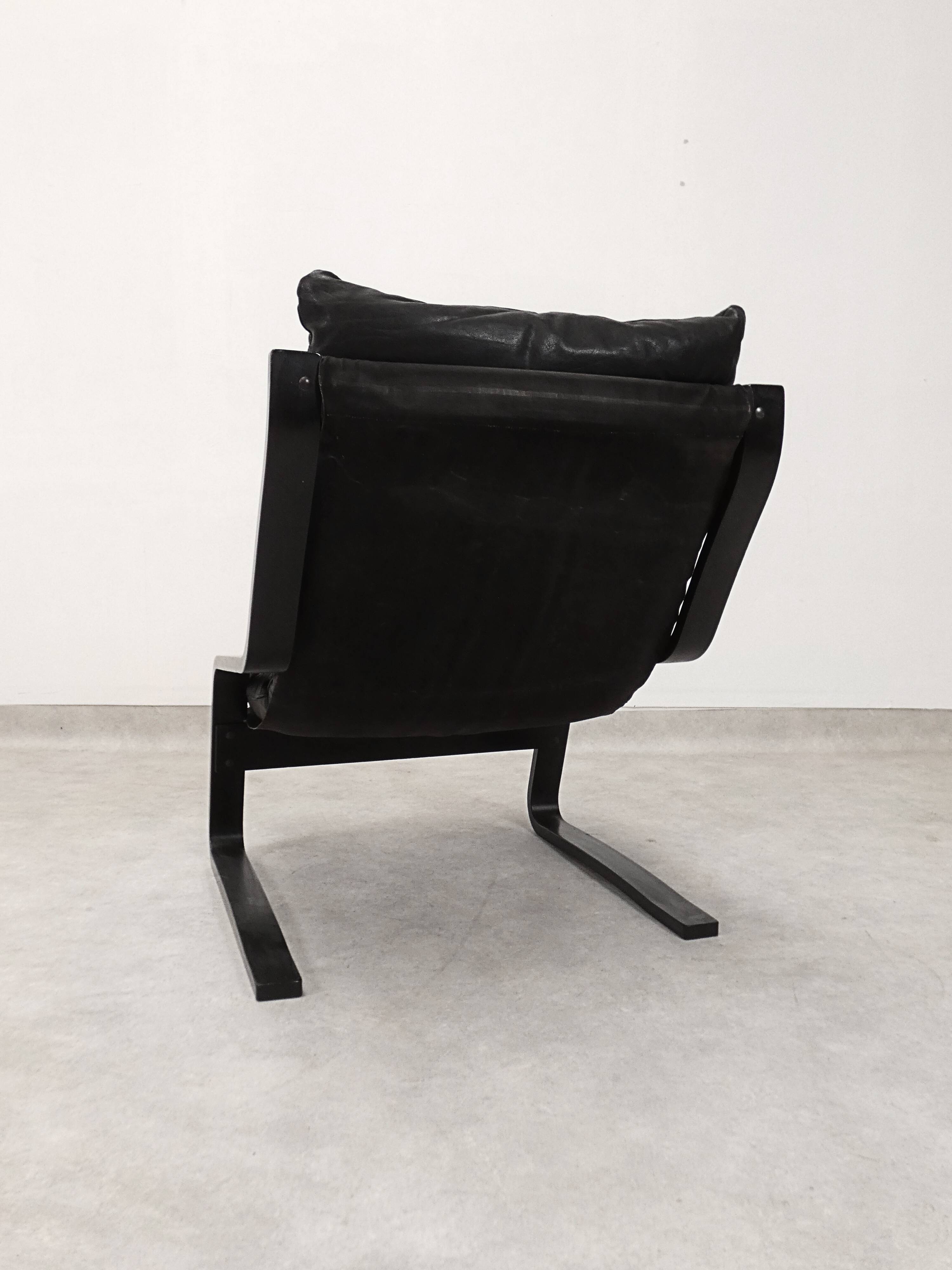 high-back scandianavian lounge chair in leather