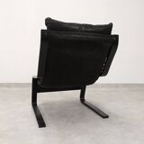 high-back scandianavian lounge chair in leather