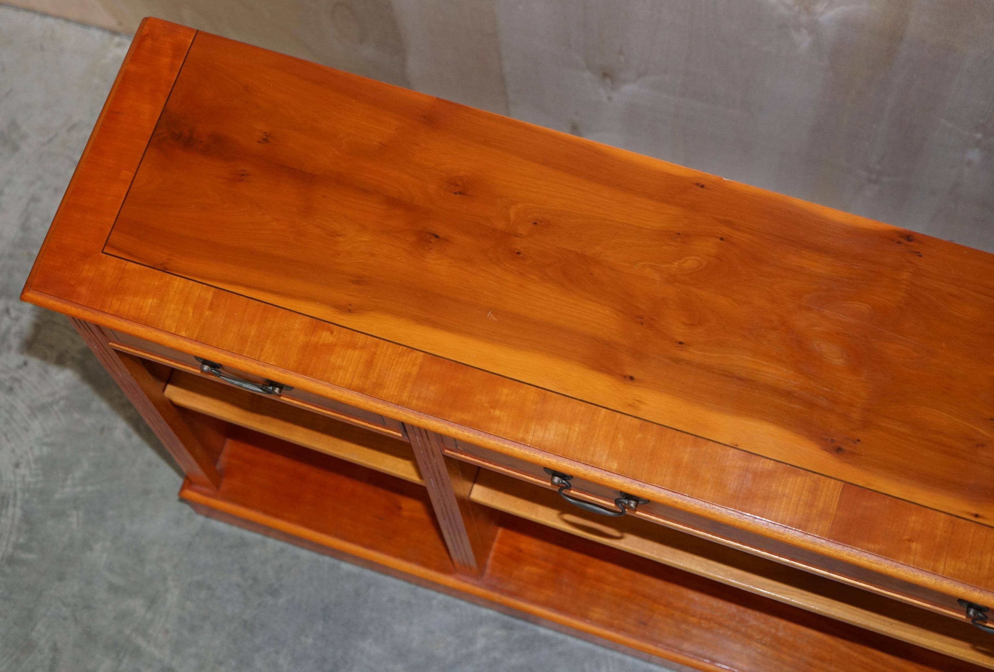 Vintage yew wood library/buffet with three drawers.
