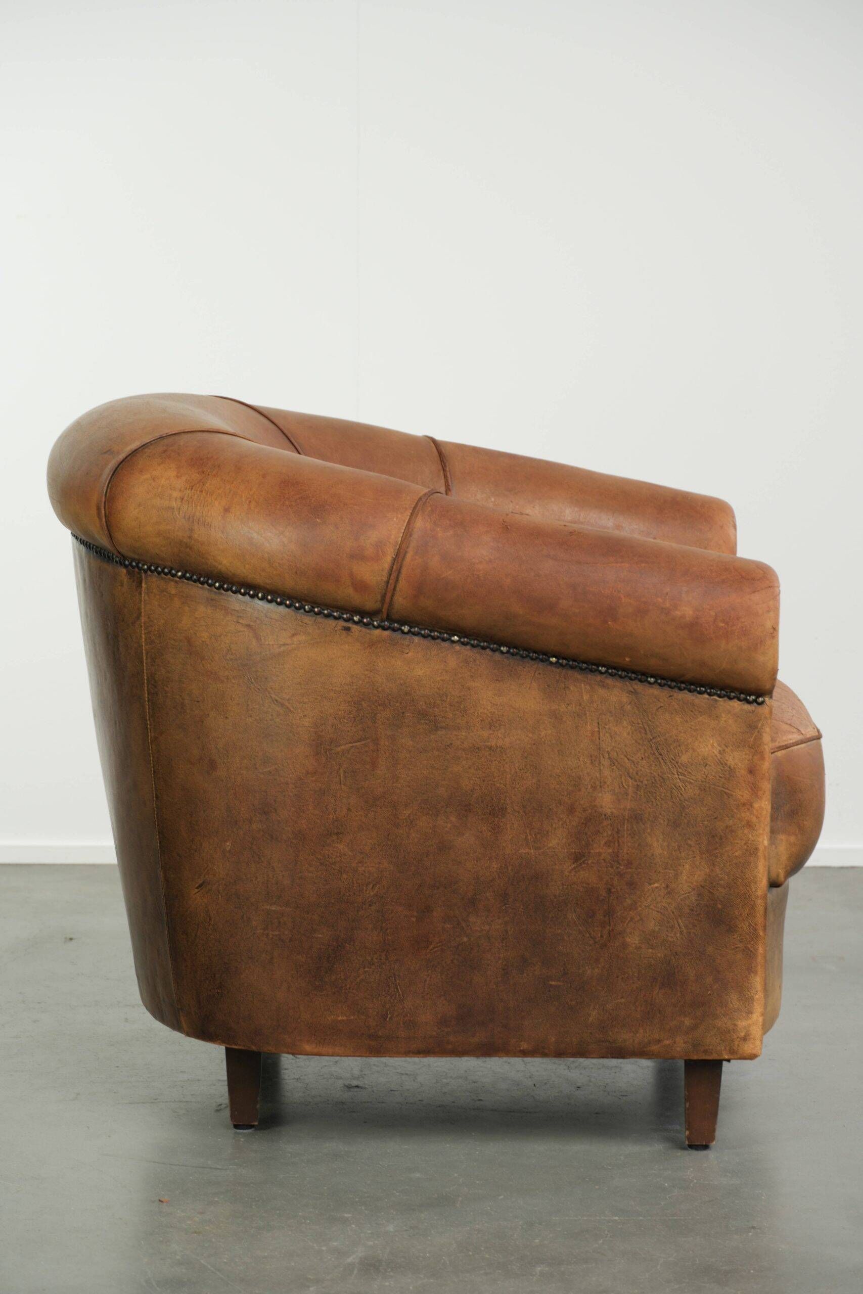 Vintage sheepskin clubchair in a beautiful cognac colour with a sturdy look