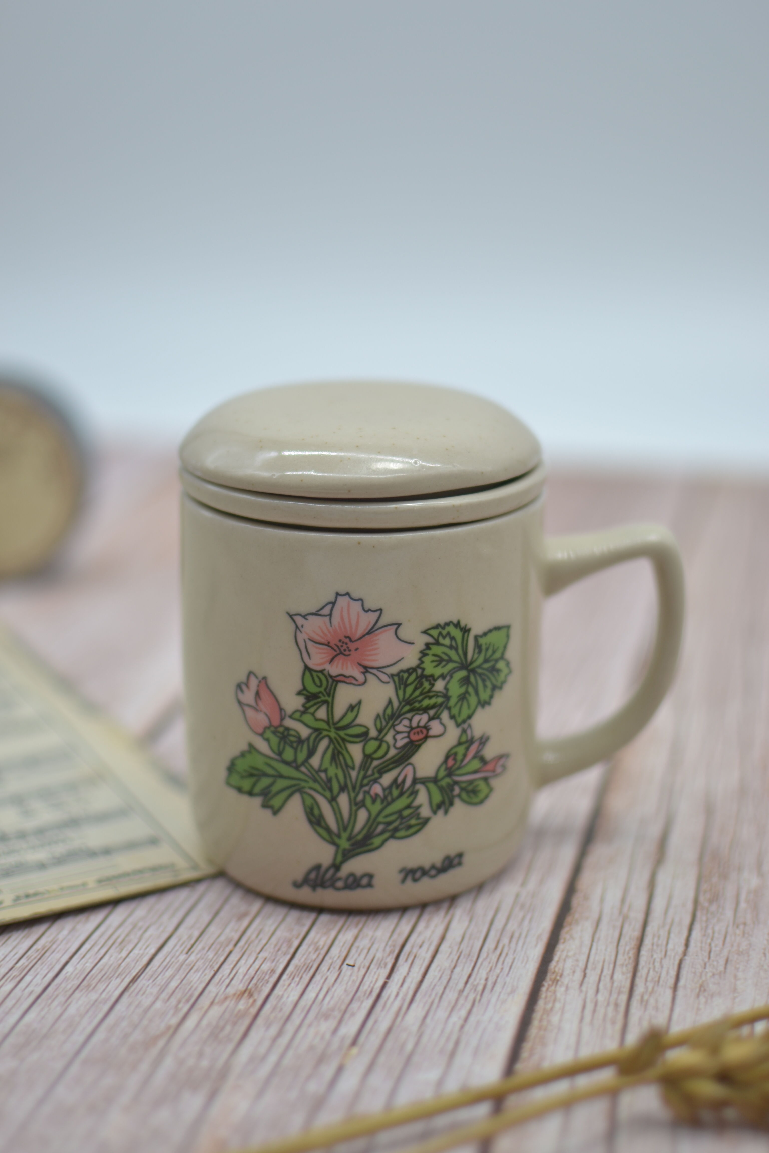 Vintage stoneware teapot with Alcea rosea infuser