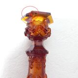 Pair of amber glass torches decorated with gothic motifs