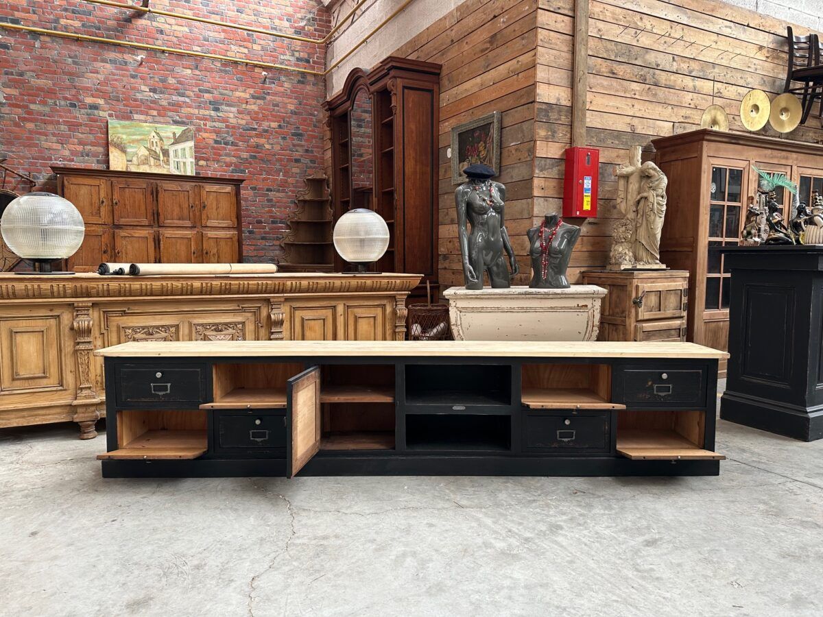 Old workshop furniture transformed into a TV unit.