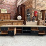 Old workshop furniture transformed into a TV unit.