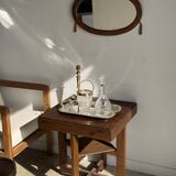 Small oval Art Deco mirror in brown and gold 33x54.