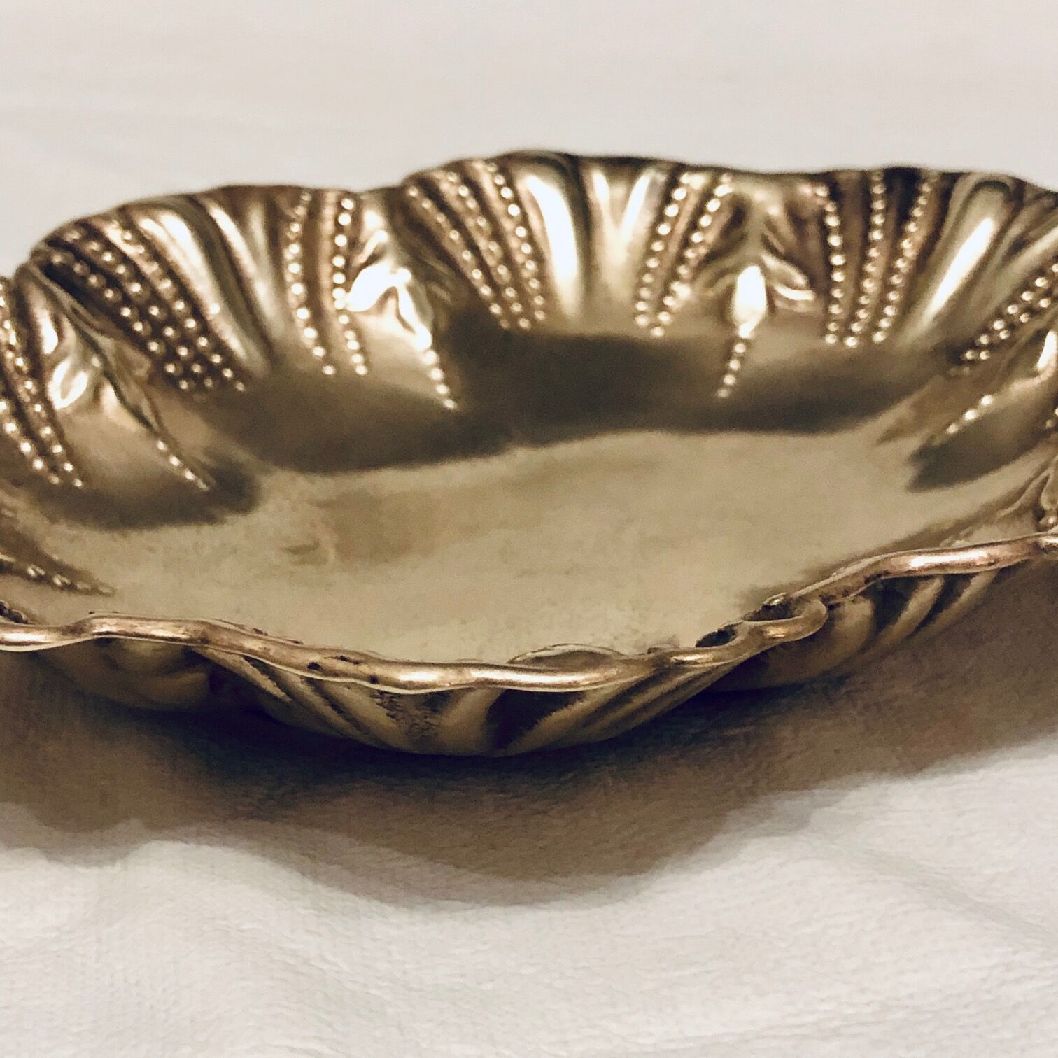 Empty oval brass pocket