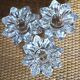 A set of 3 vintage star flower glass candle holders.