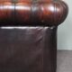 Chesterfield sofa in patinated orange leather, 2.5 seats