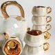 Fruit-shaped liqueur service in porcelain or tea set with its mirror tray.