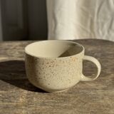 Set of 4 vintage speckled beige stoneware coffee cups.