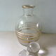 Pair of glass whiskey decanters with gold edging