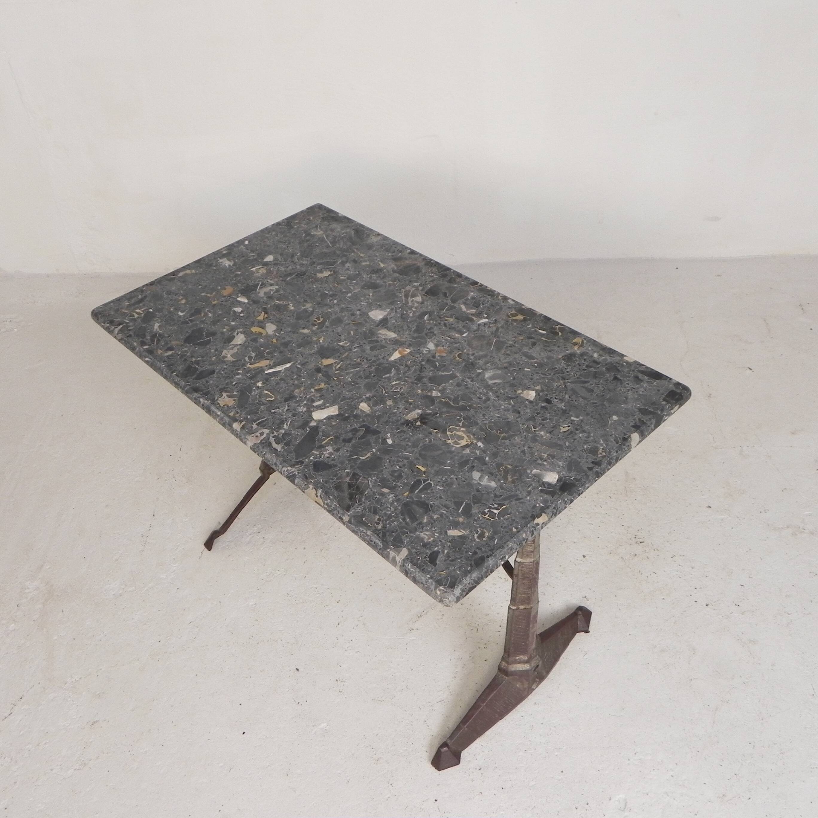 Bistro table with a marble top on a cast iron frame, 1930s.