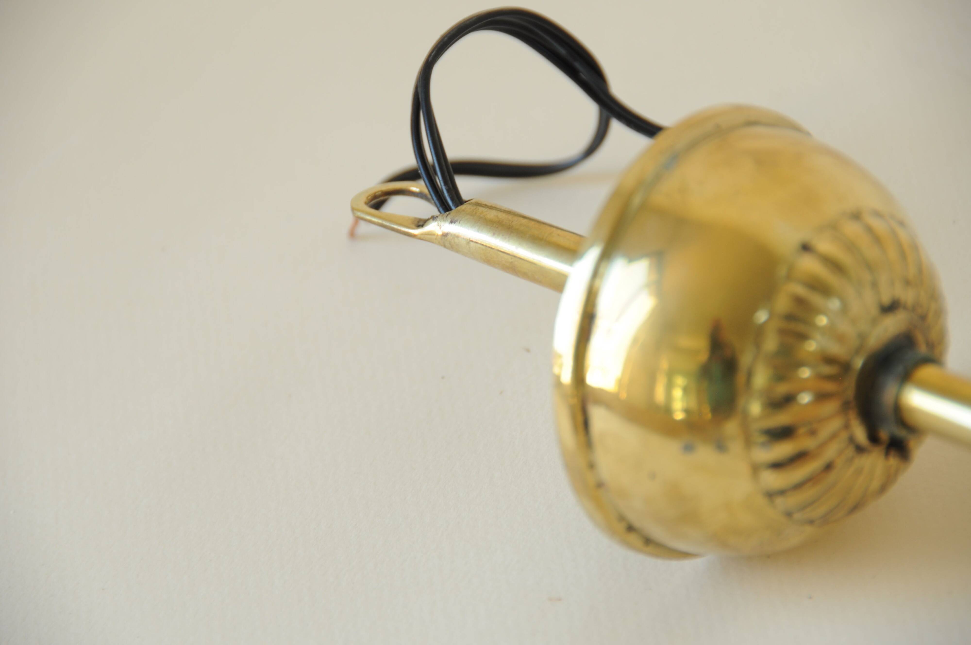 Mid century modernist pendant light in brass and textured glass ball