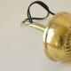 Mid century modernist pendant light in brass and textured glass ball
