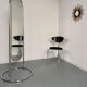 Large freestanding chrome metal full-length mirror in 1970s design.