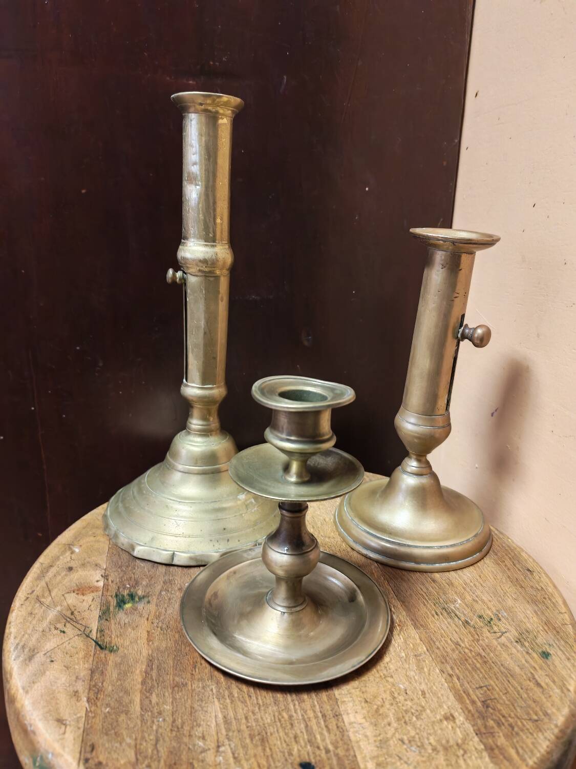 Set of three solid brass candle holders