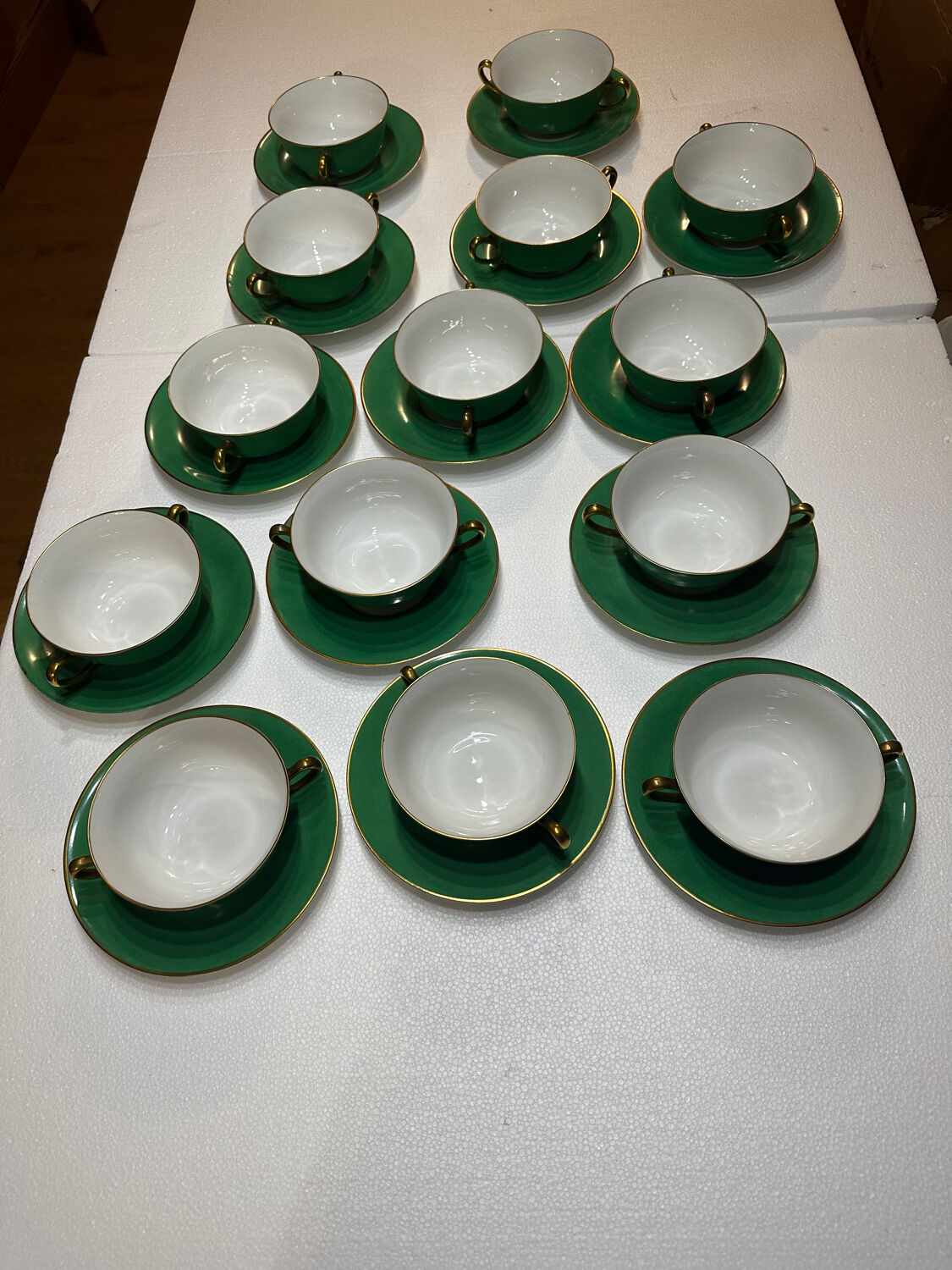 Service 14 cup and saucer in Art Deco Emerald Green and Gold.
