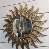 sun mirror with angel wings in golden patinated stucco