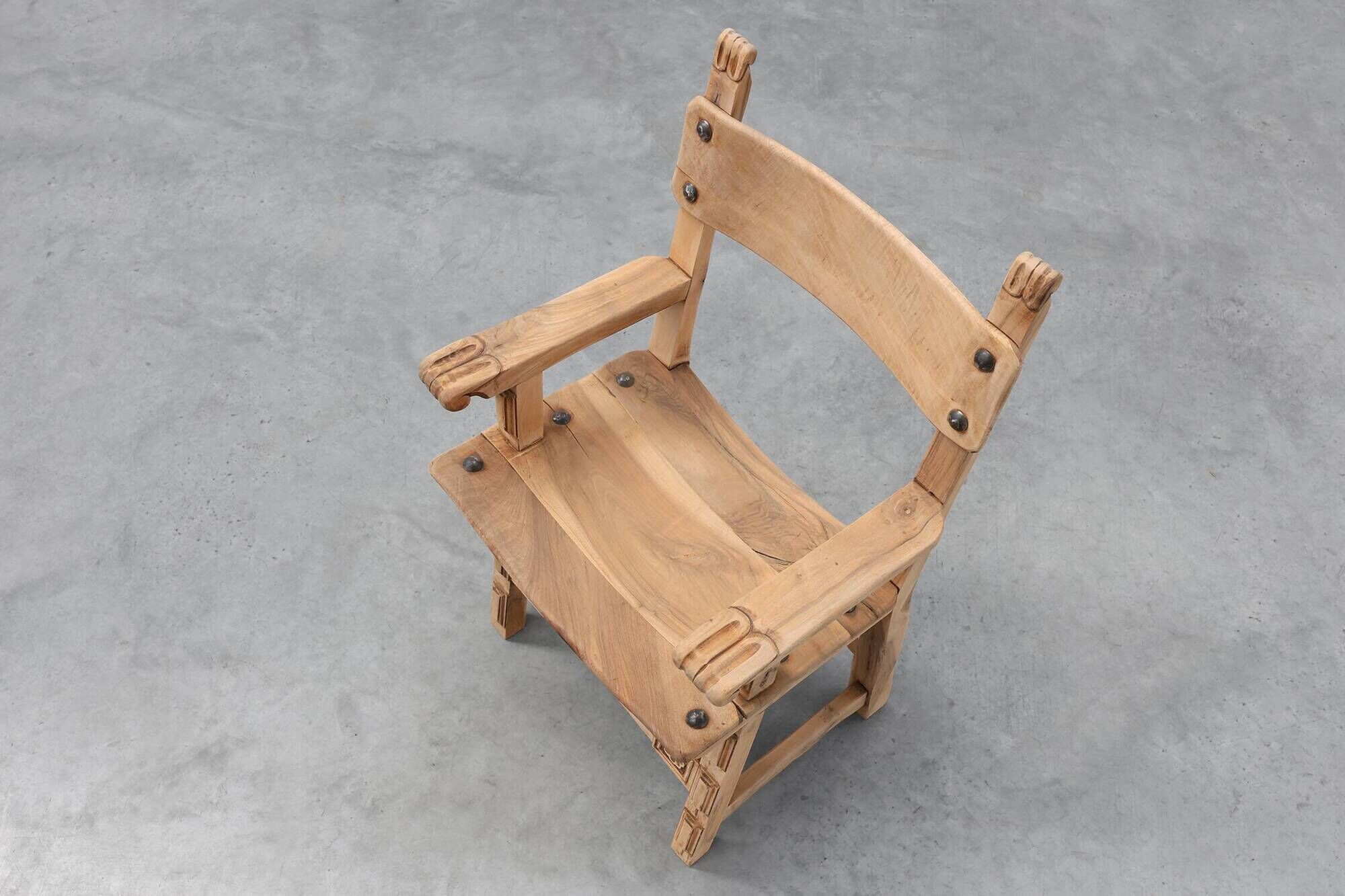 Brutalist armchair with carved rosettes and nailed wooden seat, Spain, 20th