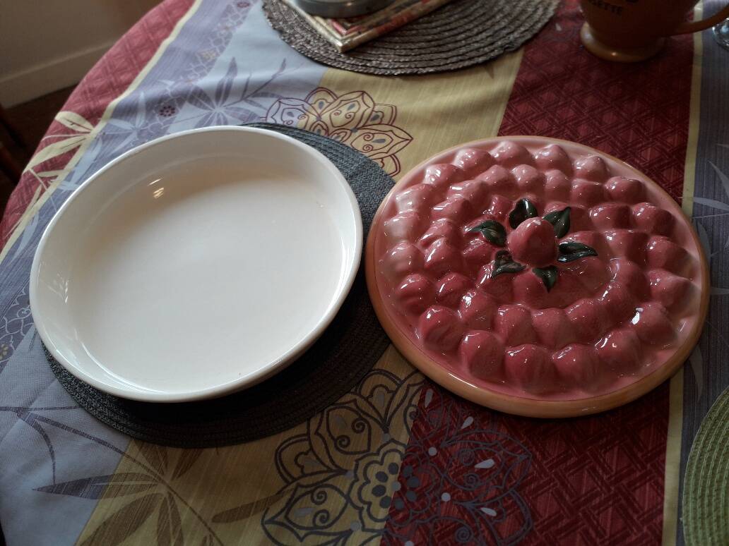 Glazed ceramic dessert plate with strawberry design.