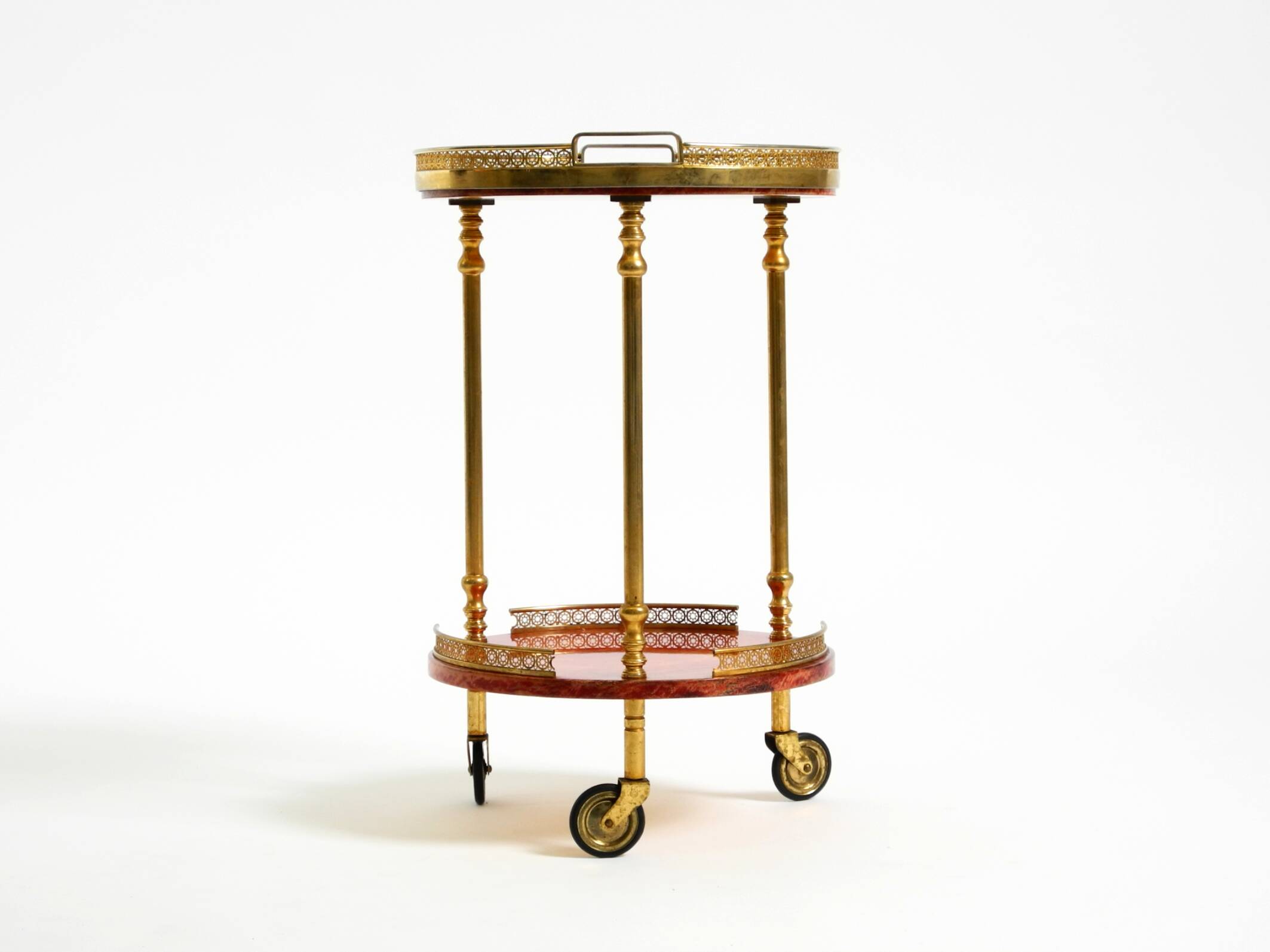 Round, small 1960s Aldo Tura serving or bar trolley in red goatskin leather