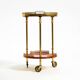 Round, small 1960s Aldo Tura serving or bar trolley in red goatskin leather