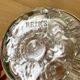 Pique flowers in metal circled glass