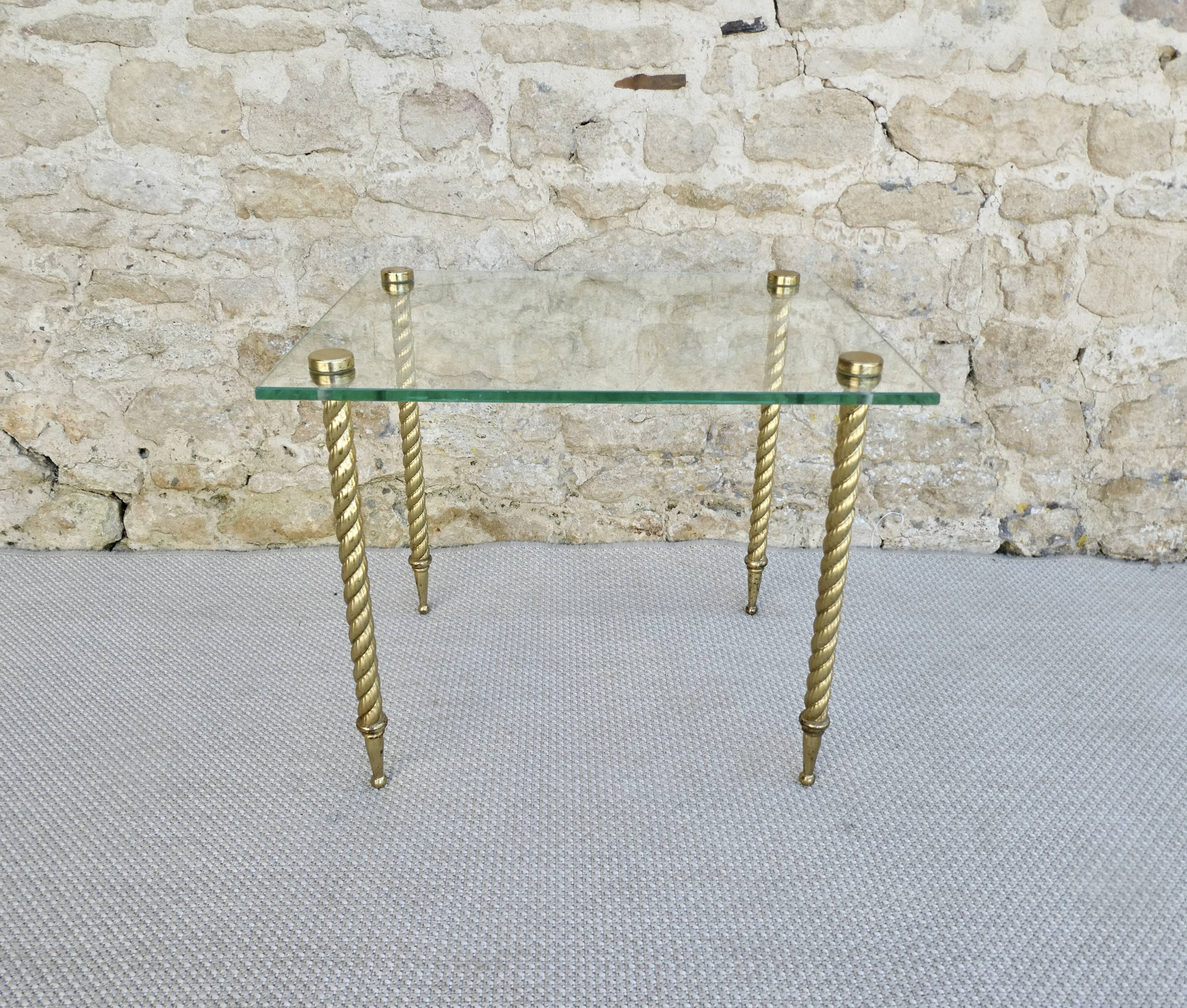 End of sofa, glass and twisted legs in gilded metal