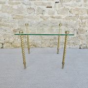 End of sofa, glass and twisted legs in gilded metal