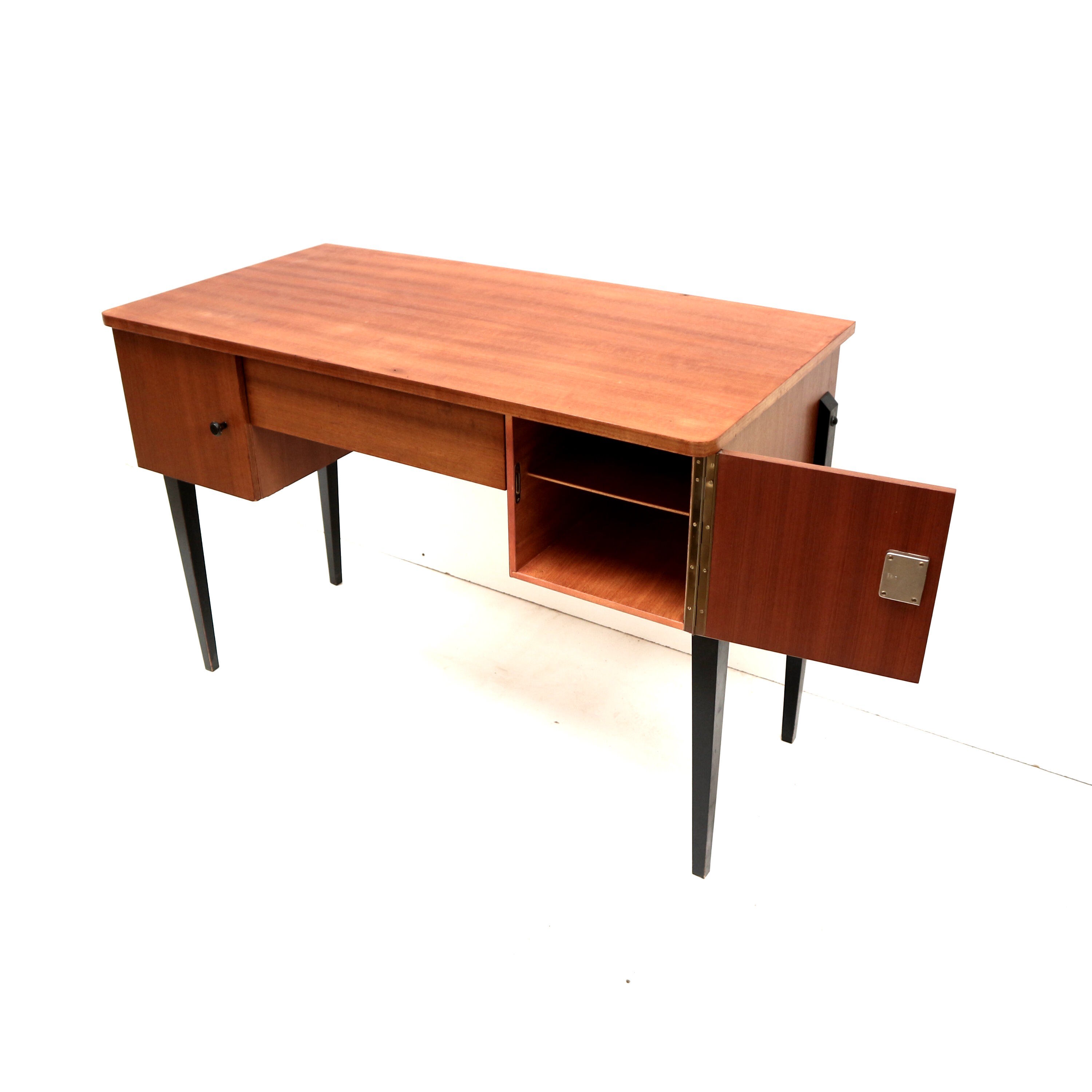 Elegant vintage desk with black legs made in the 60s