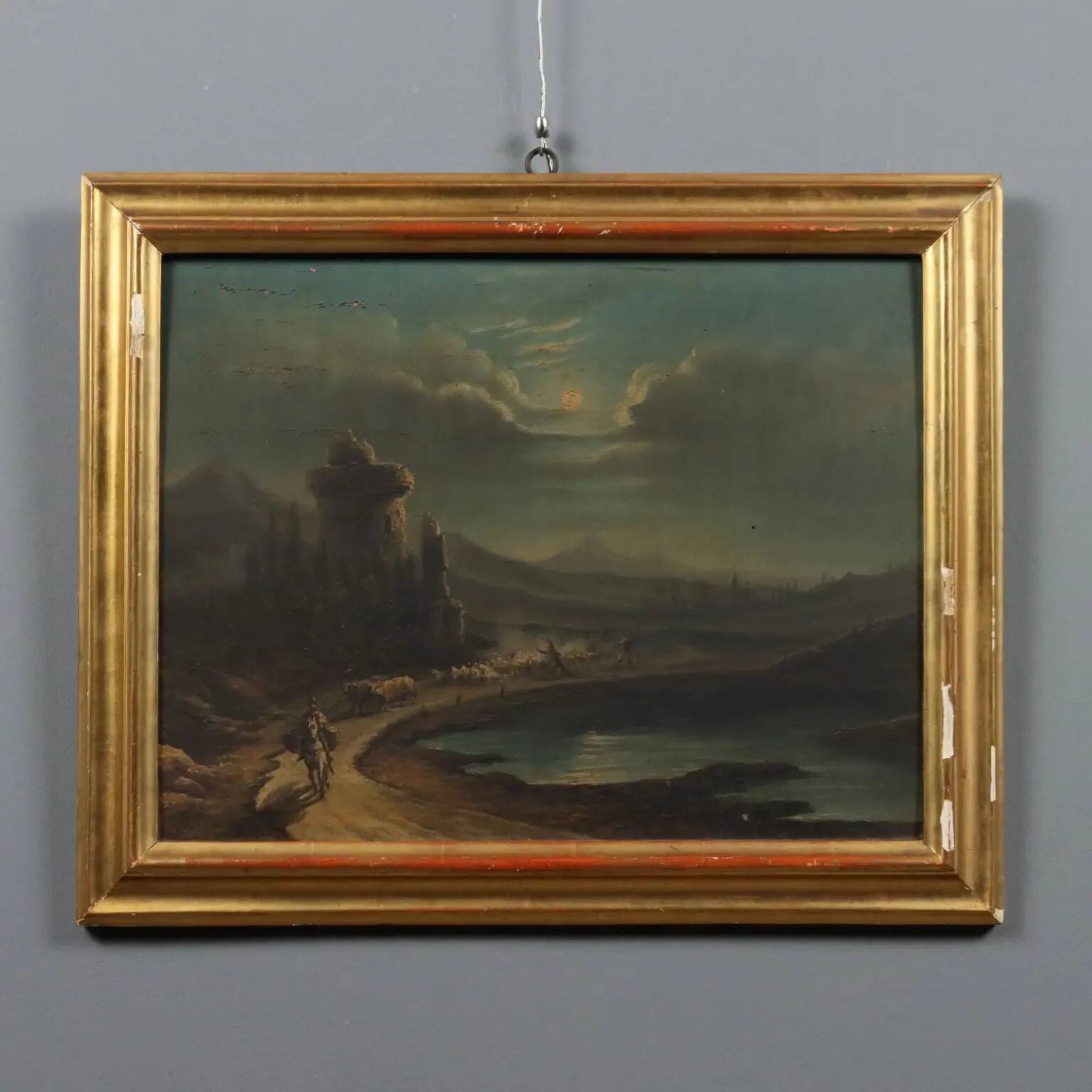 Old painting of a nocturnal landscape in oil on panel from the 19th century.