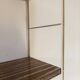 Golden wire shelf in metal with a wood effect.