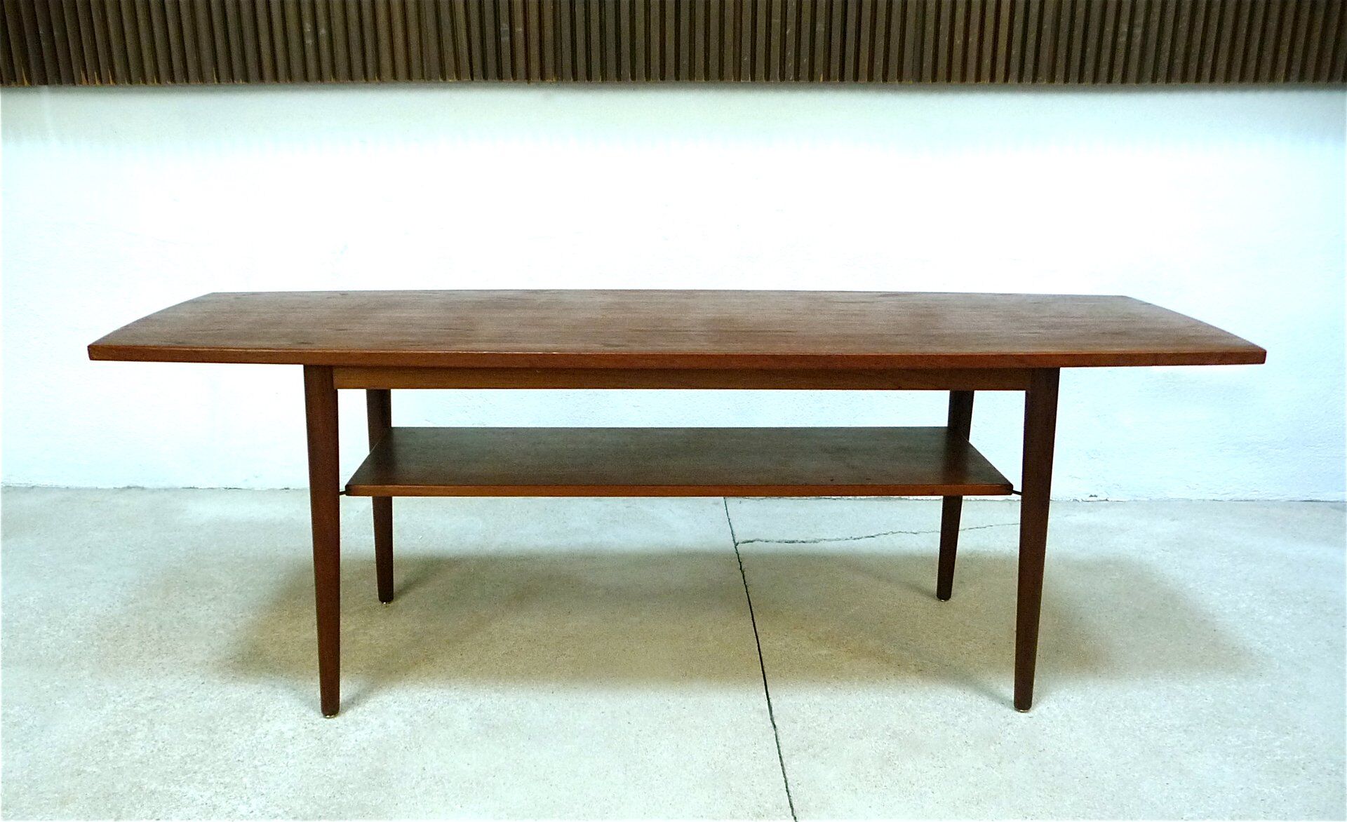 Curved Danish teak coffee table with additional shelf compartment, 1960s
