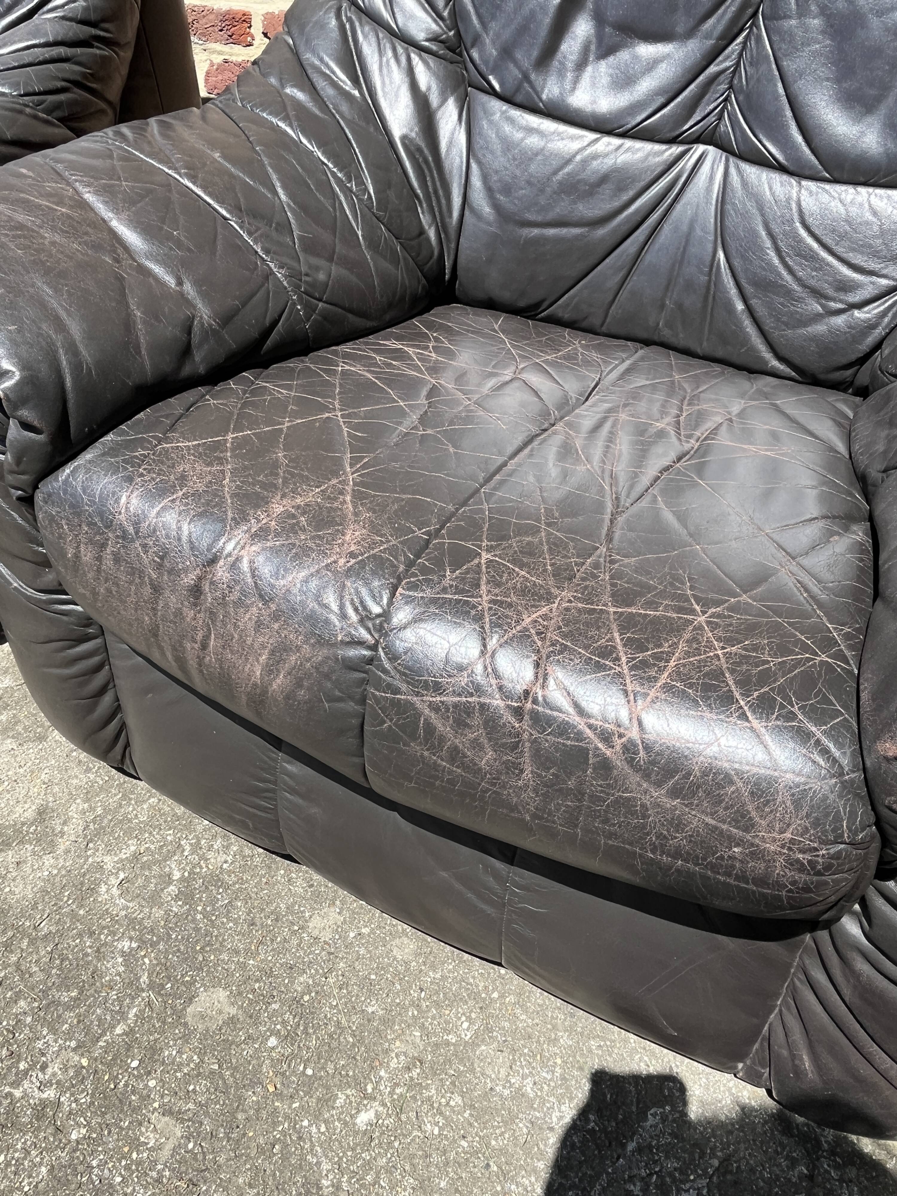 Pair of patinated leather club armchairs