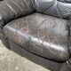 Pair of patinated leather club armchairs
