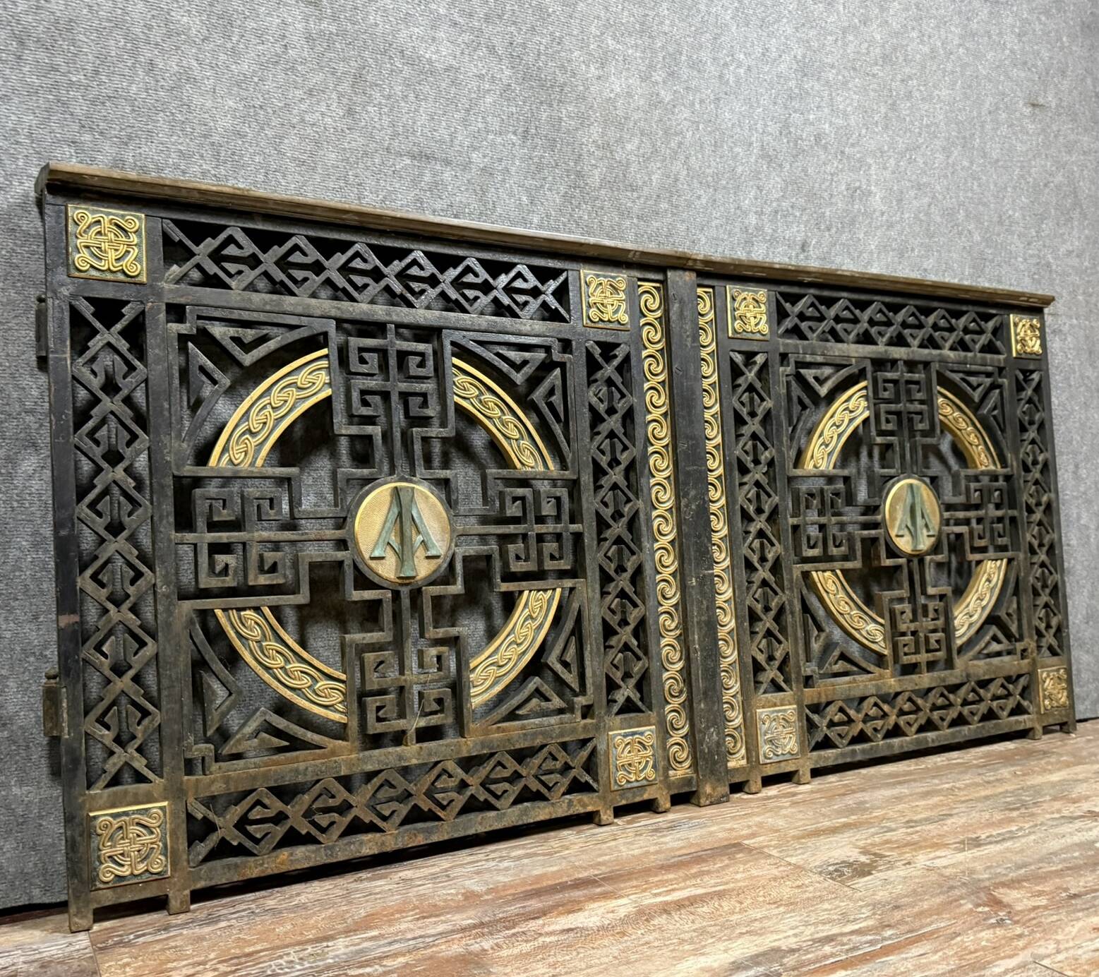pair of monogrammed cast iron doors from the Art Deco period