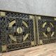 pair of monogrammed cast iron doors from the Art Deco period