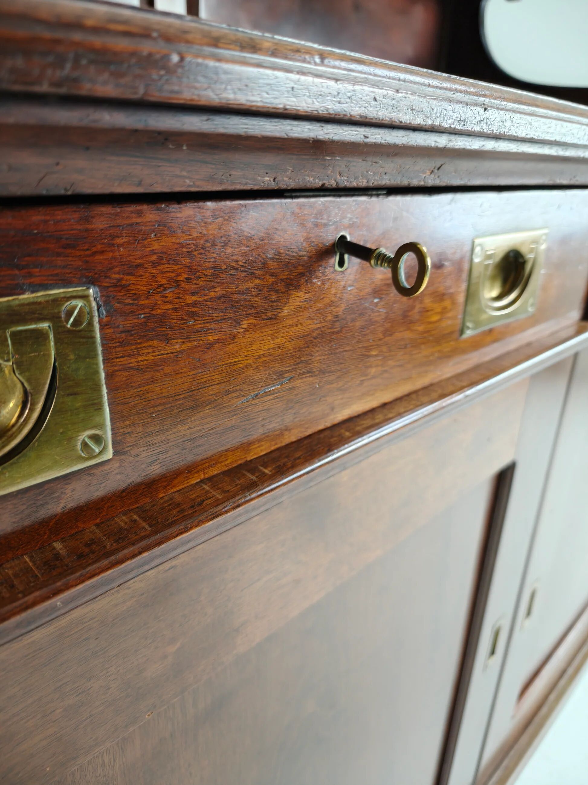 Early 20th-century English mahogany dresser / sideboard – brass campaign hardware