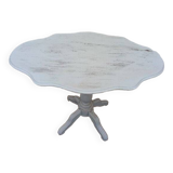Reclining gray patinated oval pedestal table