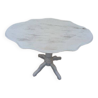 Reclining gray patinated oval pedestal table