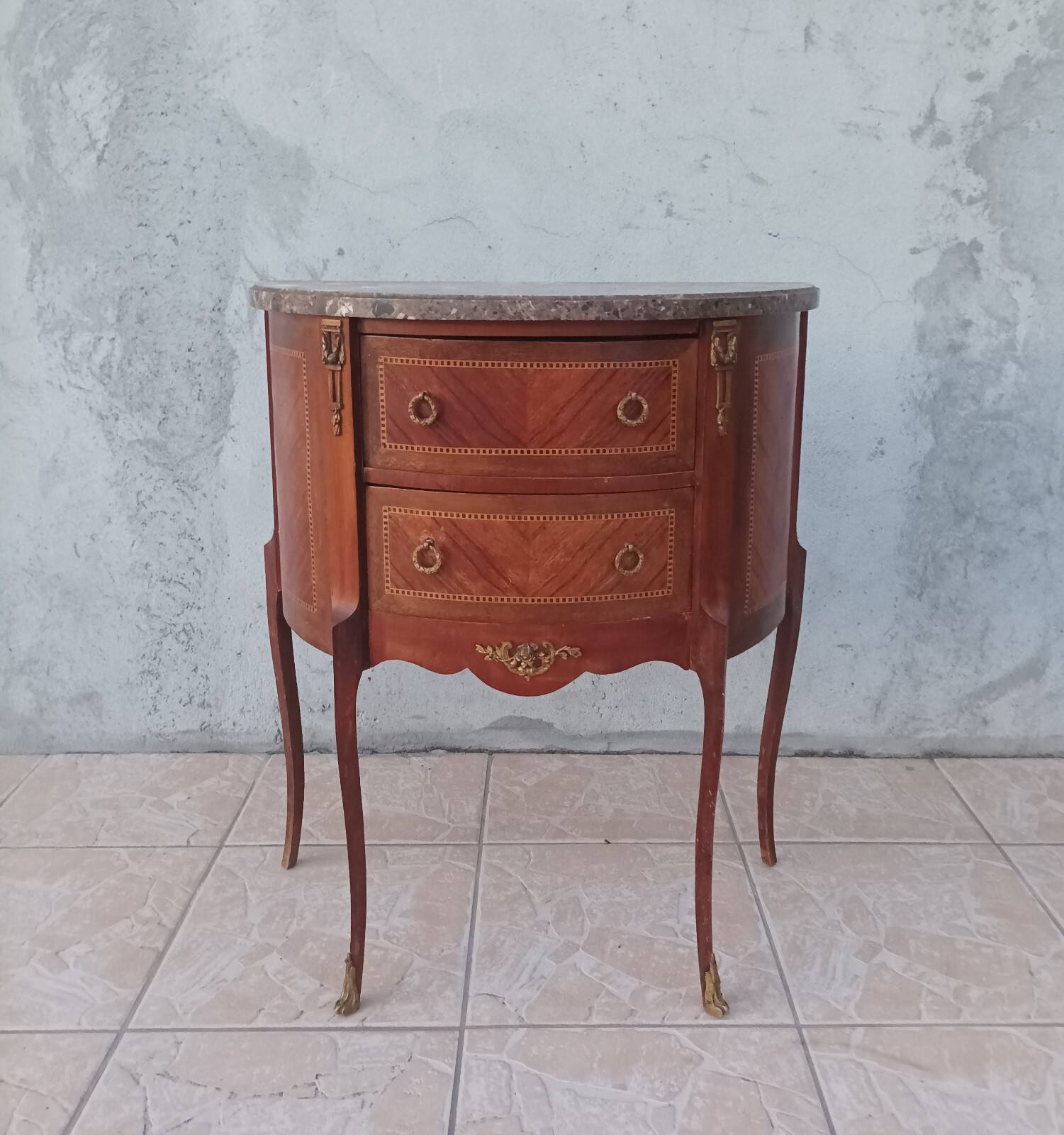 Half-moon commode in Louis XV style with walnut veneer.