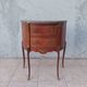 Half-moon commode in Louis XV style with walnut veneer.