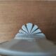 Antique porcelain sugar bowl with a decagonal base.