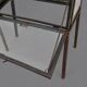 A showcase made of steel and glass, mounted on a custom-made steel base.