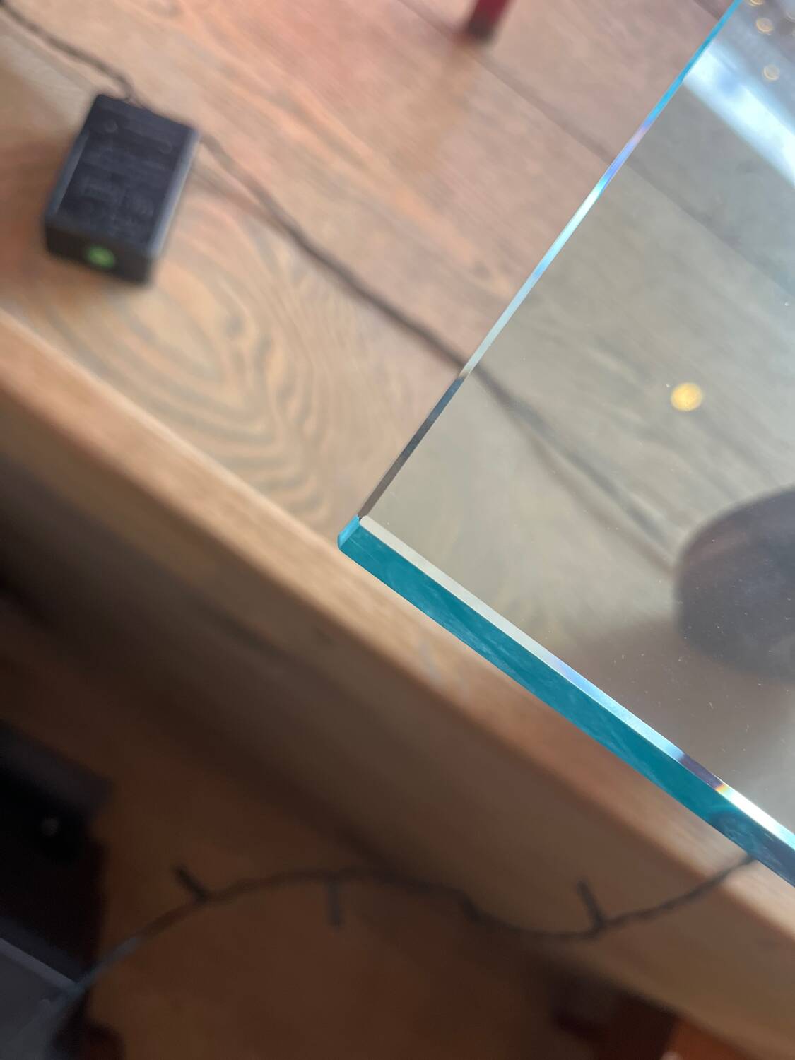 Gae Aulenti coffee table for Fontana Arte, transparent glass top with black cast iron supports, 1980s.