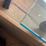 Gae Aulenti coffee table for Fontana Arte, transparent glass top with black cast iron supports, 1980s.